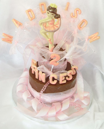 chocolate ballereina on single chocolate tier, decorated with coloured chocolate and ribbon