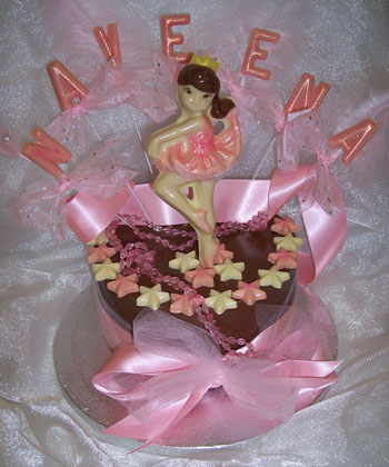 chocolate ballereina on single chocolate tier, decorated with coloured chocolate and ribbon