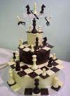 chocolate chess pieces on three chocolate tiers