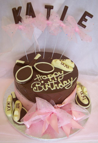 chocolate tennis theme on single chocolate tier, decorated with coloured chocolate and ribbon