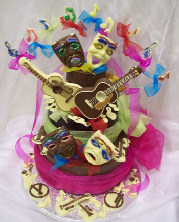 chocolate theatrical scene on a chocolate tier, decorated with coloured chocolate and ribbon