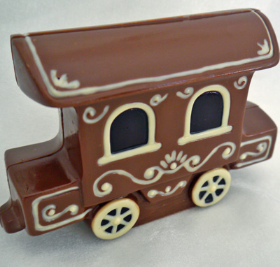a picture of chocolate train carriage engine decorated with white, milk and dark, chocolate