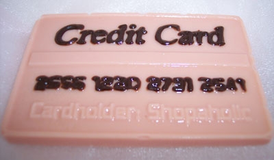 a picture of a milk chocolate credit card decorated with coloured chocolate