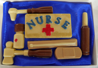 a picture of chocolate nurse set with white, dark, milk, and coloured chocolate