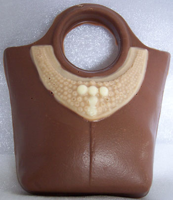 a picture of a milk chocolate shopping bag, decorated with coloured chocolate