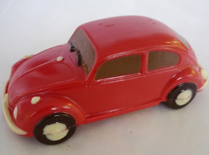 a picture of a red chocolate VW beetle