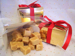 a picture of mixed truffles gift wrapped in a gold box