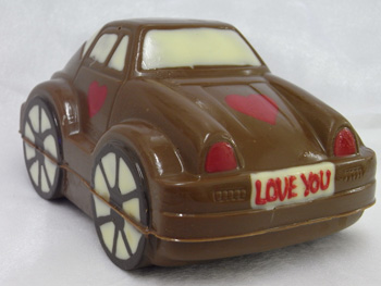 a picture of chocolate beetle car decorated with hearts