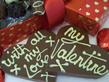 Two milk chocolate valentine decorated with White chocolate.  One display shows my 'Valentine message', the other, 'with all my love'