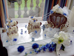 milk chocolate carriage with white chocolate horses decorated with flowers