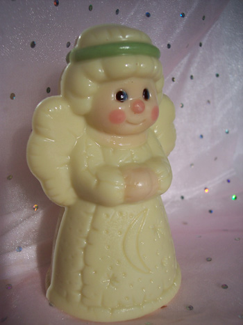 a picture of a white chocolate Angel decorated with and coloured chocolate.