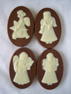 a picture of four chocolate angels each a different design