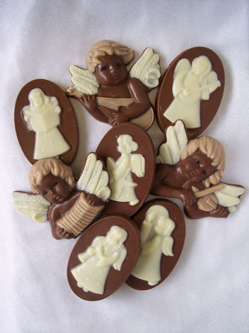 a picture of three chocolate cherubs, and four chocolate angels.