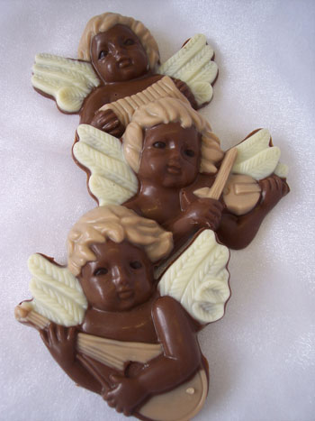 a picture of three milk chocolate cherubs, decorated with white and coloured chocolate.