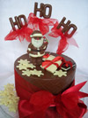a picture of a milk chocolate snowman on a chocolate tier